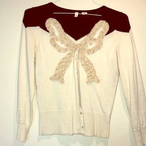 Anthropologie cream and black sweater with bow, m